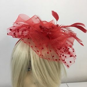 Fascinator. Headdress with feather. Red